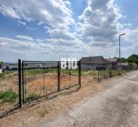 Plots - housing in Štitáre with fencing and surrounding houses in the countryside.