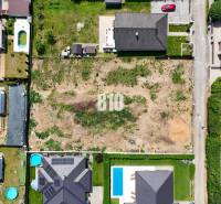Aerial view of residential plots in Štitáre, surrounded by family houses.