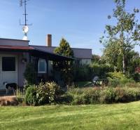 A family house in Čierna Voda with a garden, a dog, and an adjacent terrace for relaxation.