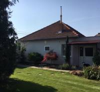 A family house in Čierna Voda with a landscaped garden and a terrace for relaxation.