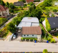 A family house on Záblatská Street in Trenčín, surrounded by greenery and other houses.
