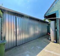 A sheet metal garage next to a family house on Záblatská Street in Trenčín.