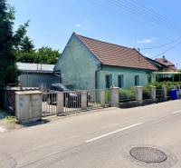 A family house on Záblatská Street in Trenčín with a car and a garage.