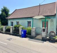 A family house on Záblatská Street in Trenčín with a blue facade and gate.