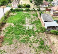 Plots - housing in Bardoňovo, showing a wooded parcel with rural houses in the background.