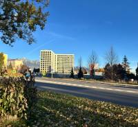 Autumn scenery on Karpatská Street in Poprad with a panorama of mountains in the background.