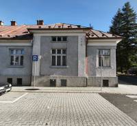 A family house in Banská Bystrica in Uhlisko with a parking space and a metal roof.