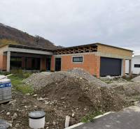Family house under construction, Teplička nad Váhom, Na Kúty, with piles of soil and construction materials.