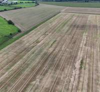 Arable land in agricultural and forest plots, Nová Ves nad Váhom, surrounded by green meadows.