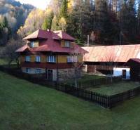 A family house in Zázrivá surrounded by nature and forests, with a large yard space.