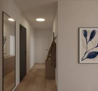 A hallway with a wooden floor, a mirror, and a painting in a 2-room apartment, interior.
