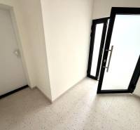 Entrance hallway in a 2-room apartment with glass doors.