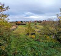 The land of Velký Babu with residential plots, surrounded by greenery and a rural environment.