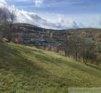 Autumn nature in the gardens in Hlboké nad Váhom with hills and trees.