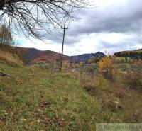 Autumn in the gardens of Hlboké nad Váhom with colorful leaves and hills in the background.