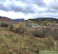 Autumn landscape in Hlboké nad Váhom with a colorful forest and a village in the valley.