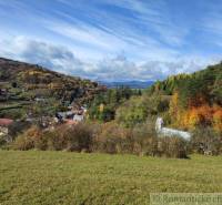 Autumn in the Gardens near Hlboké nad Váhom shows a colorful forest and picturesque houses.