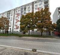 Apartment building with colorful elements and trees on Hraničná Street, Bratislava - Ružinov.