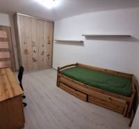 Children's room with a bed, desk, and wardrobe in a 3-room apartment.