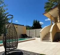 Family house in Komárno, exterior with garden, swimming pool, and relaxation corner.