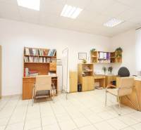 Offices with furniture, chairs, and bookshelves, floor with ceramic tiles.