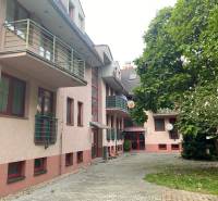 Apartment building with balconies and greenery on Mierová Street in Bratislava, Ružinov district.