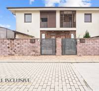 Two-story house with a brick fence in Gabčíkovo, suitable for a 3-room apartment.