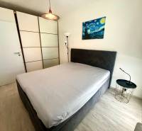 Bedroom in a 3-room apartment with a wardrobe and a nightstand.