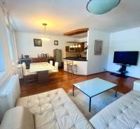 Living room with kitchen in a 3-room apartment, equipment includes a sofa, table, and television.