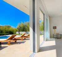 Luxury villa in Bale with a pool, sun loungers, and a spacious terrace.
