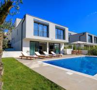 A villa in Bale with a swimming pool, sun loungers, and a garden for relaxation.