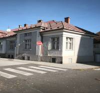 A family house in Uhlisko, Banská Bystrica with a car on the street.