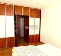 Bedroom with a built-in wardrobe and wooden decor flooring in a 3-room apartment.