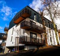 Apartment complex on Lúčná Street in Štrba with balconies and parking in a beautiful environment.