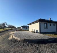 Family house on Vyšná Šebastová Street in Prešov, paved terrace, clear blue sky.