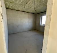 Room under construction with a window, thermally insulated ceiling, in a family house Vyšná Šebastová.