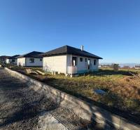 A family house under construction on Vyšná Šebastová Street in Prešov under a clear sky.
