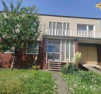 Family house on Vieska Street in Radošovce with a brick facade and a garden.
