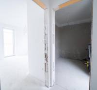 Interior of a family house with two rooms, ready for completion.