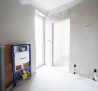Interior of a family house with an installation system and plastered walls ready for completion.