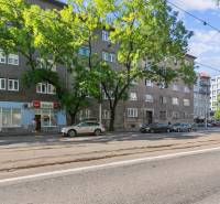 Vajnorská Street in Bratislava - Nové Mesto, where there are residential buildings and shops.
