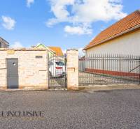 Family house on Kúpeľná Street in Dunajská Streda with a gate and a paved yard.
