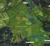 Aerial view of agricultural and forest lands around Štrba with marked boundaries of cadastral areas.