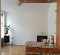 Interior of a 2-room apartment with a wooden decor floor and simple decoration.