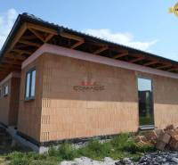 A family house in Nové Mesto nad Váhom, showing a construction site with a brick facade.