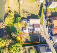 An aerial view of the land in Jahodná, surrounded by greenery and a water body.