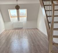 3-room apartment with wood-patterned flooring and wooden staircase.