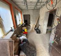 A room in a family house with renovation. Building material, windows covered with foil.