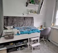 A children's room in a 3-room apartment with a bed, storage space, and a study corner.