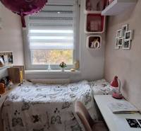 Children's room in a 3-room apartment with decorations and a desk.